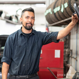 Smiling car mechanic.